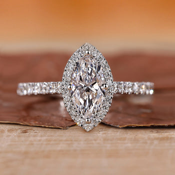 Marquise diamond ring with a diamond round cut shines brightly.