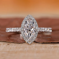 Marquise diamond ring with a diamond round cut shines brightly.
