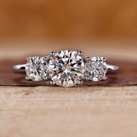 3 stone round diamond ring with timeless elegance.