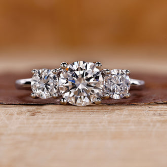 3 stone round diamond ring with timeless elegance.