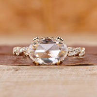 Double claw prong setting enhances the beauty of this custom engagement ring.