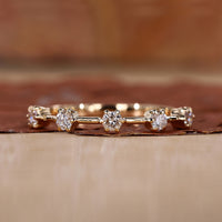 5 stone wedding band with a timeless design for special occasions.
