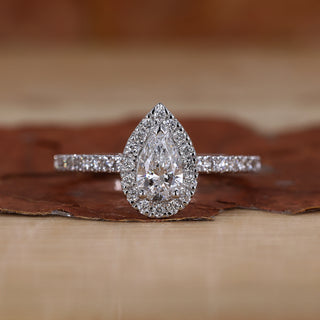 Pear Halo Engagement Ring with a stunning pave diamond band.
