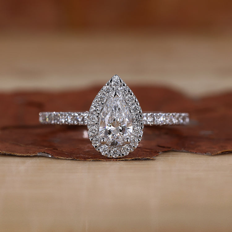 Pear Halo Engagement Ring with a stunning pave diamond band.