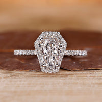 Coffin cut engagement ring with halo diamond ring.