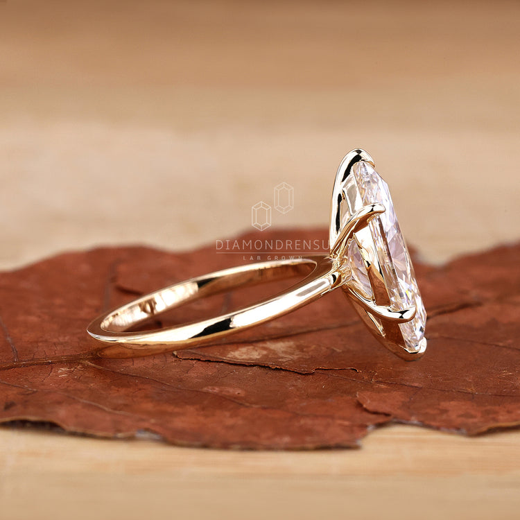 Gold Solitaire Engagement Ring with a classic and modern touch.
