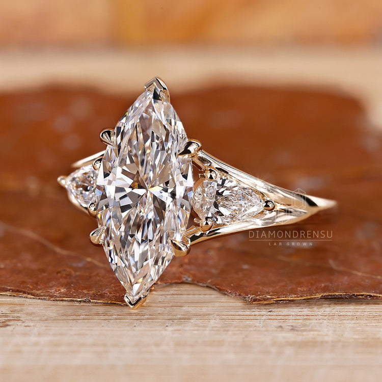Marquise Diamond Ring with Pear Side Stones for added charm.
