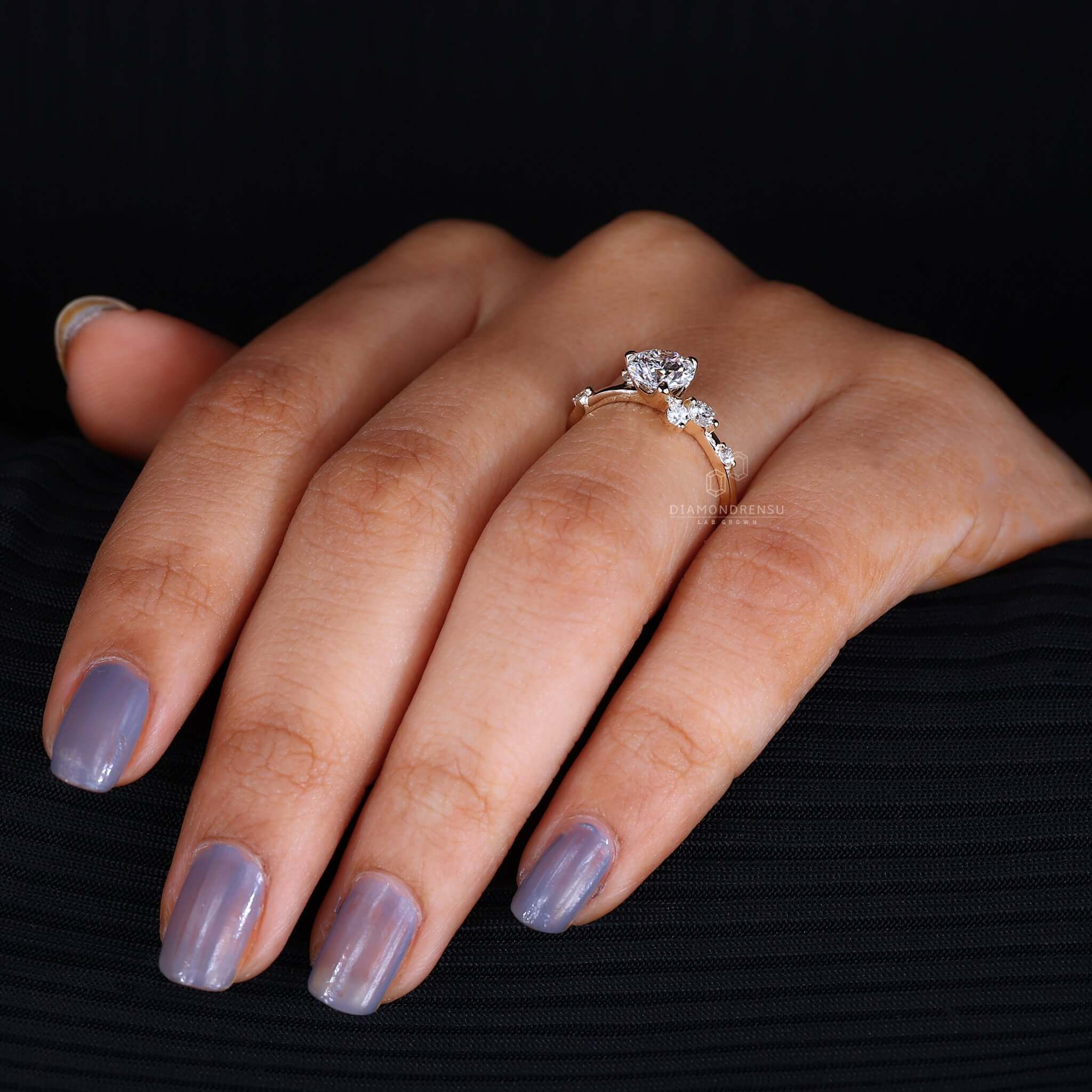 Innovative diamond bubble ring on hand, blending contemporary style with classic diamond beauty.