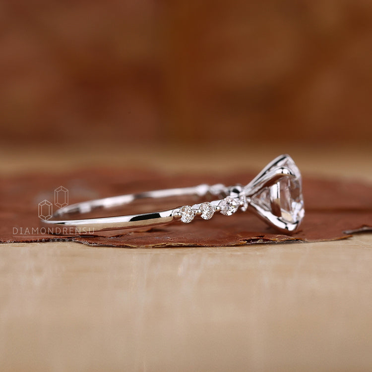 Dazzling round and marquise diamond ring with intricate details.