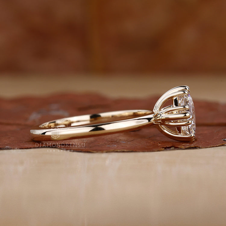 Triple prong ring showcasing a unique and secure diamond setting.