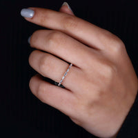 Handmade full eternity band with shared prongs