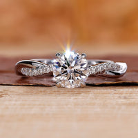 Close-Up of Round Diamond Engagement Ring with Twisted Pave Band