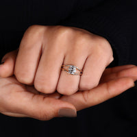 Vintage-style old European cushion cut diamond set in a classic ring.