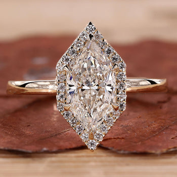 Marquise diamond halo engagement ring in yellow gold