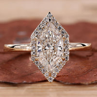 Marquise diamond halo engagement ring in yellow gold