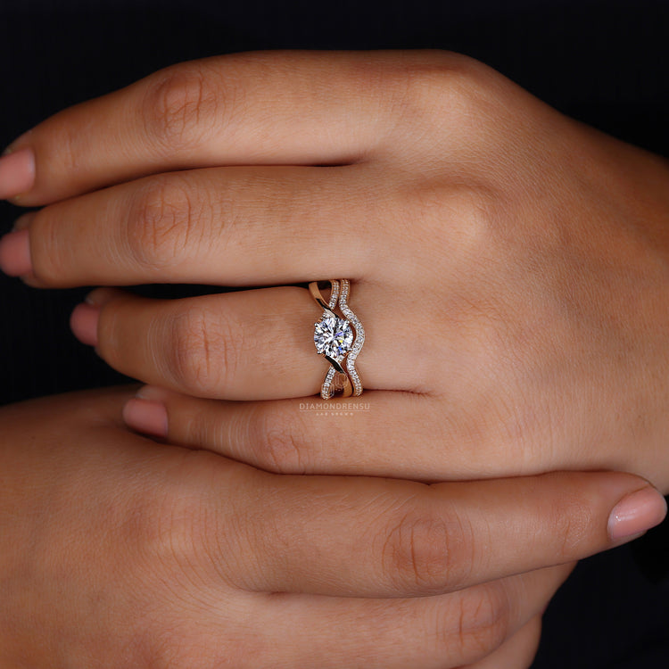 Twisted Pave Band with a round cut diamond centerpiece.