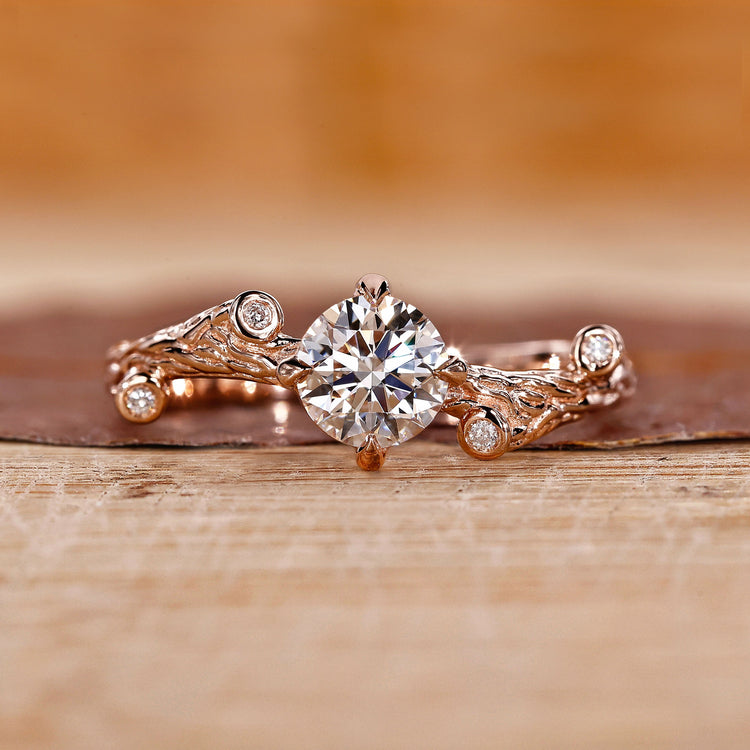 Nature-inspired engagement ring with intricate floral details and a stunning diamond center.