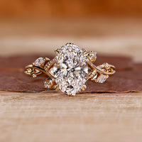 Nature inspired engagement ring with oval diamond.
