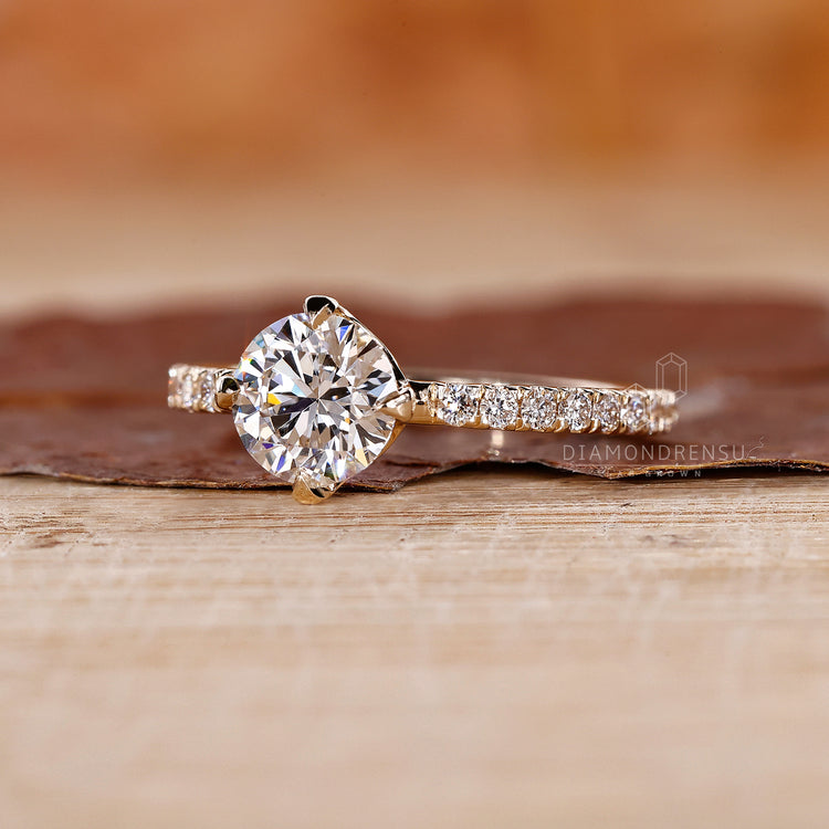 Yellow Gold Ring with a radiant round cut diamond center.