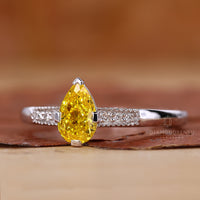 Yellow Pear Diamond Ring in a beautiful prong setting.