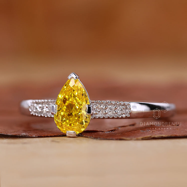 Yellow Pear Diamond Ring in a beautiful prong setting.