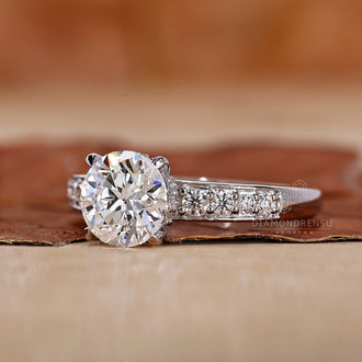 Round Cut Diamond Ring with pave ring setting for extra sparkle.