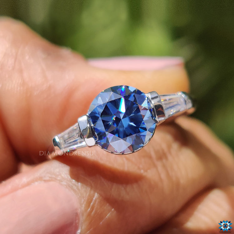 Classic round moissanite ring with side stones.