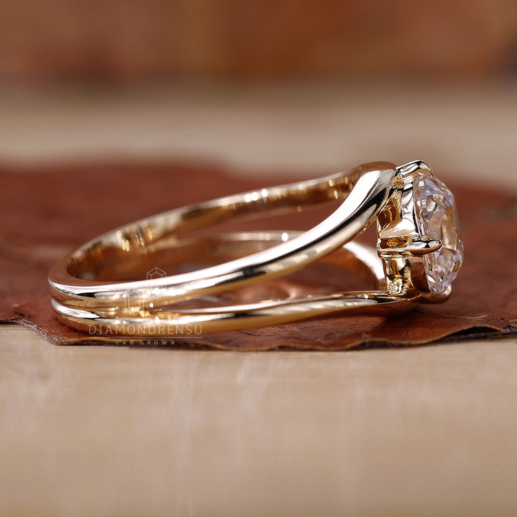 Old European cushion cut diamond ring with intricate detailing.