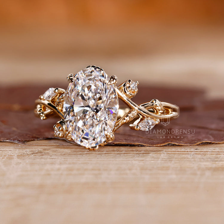 Yellow gold oval diamond engagement ring.