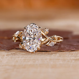 Yellow gold oval diamond engagement ring.