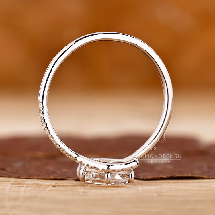 Custom engagement ring with 6 claw prong and unique halo setting.