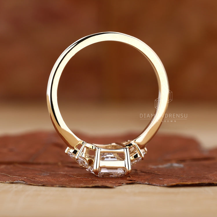 Diamondrensu ring with a timeless emerald cut engagement design.