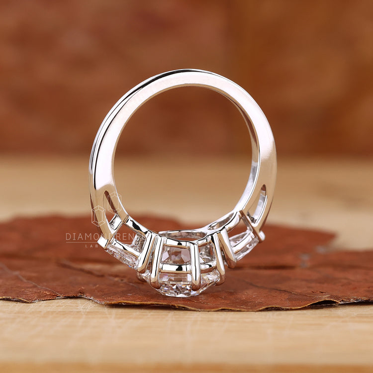 Three stone white gold ring with a sleek finish.