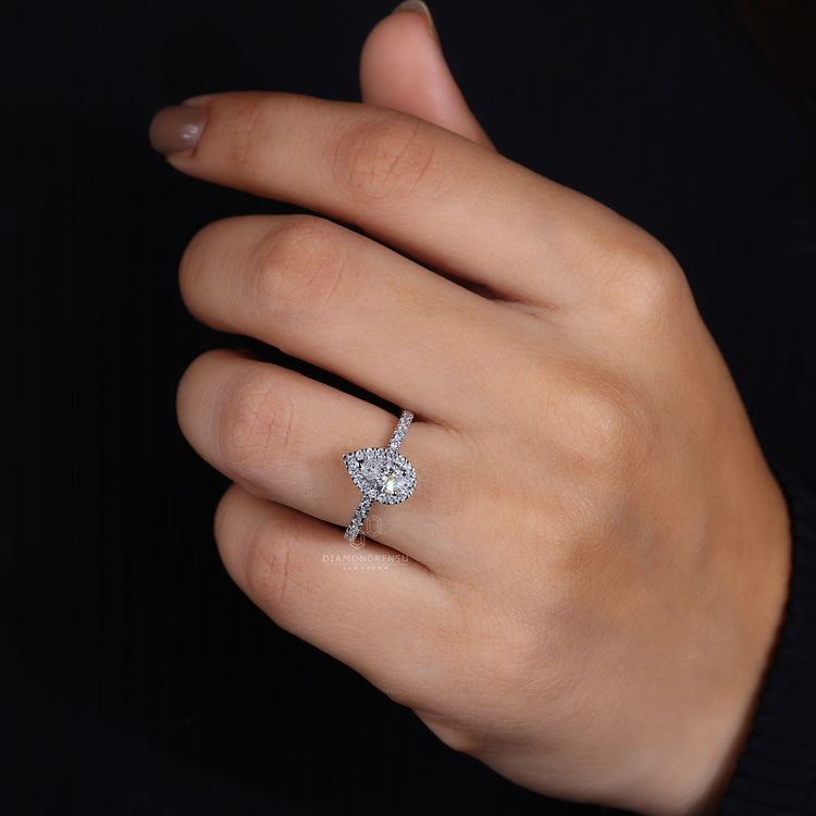 Teardrop engagement ring crafted in a classic white gold design.
