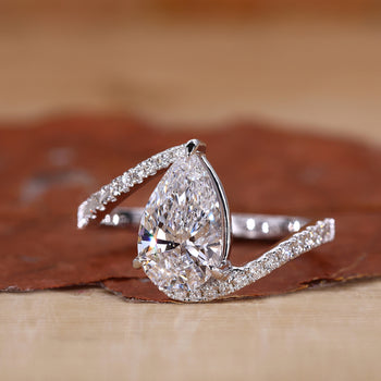 Bypass Setting Ring with a stunning pear shaped engagement ring.