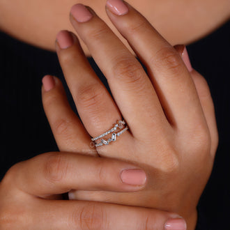 Yellow gold wedding band with intricate diamond details.