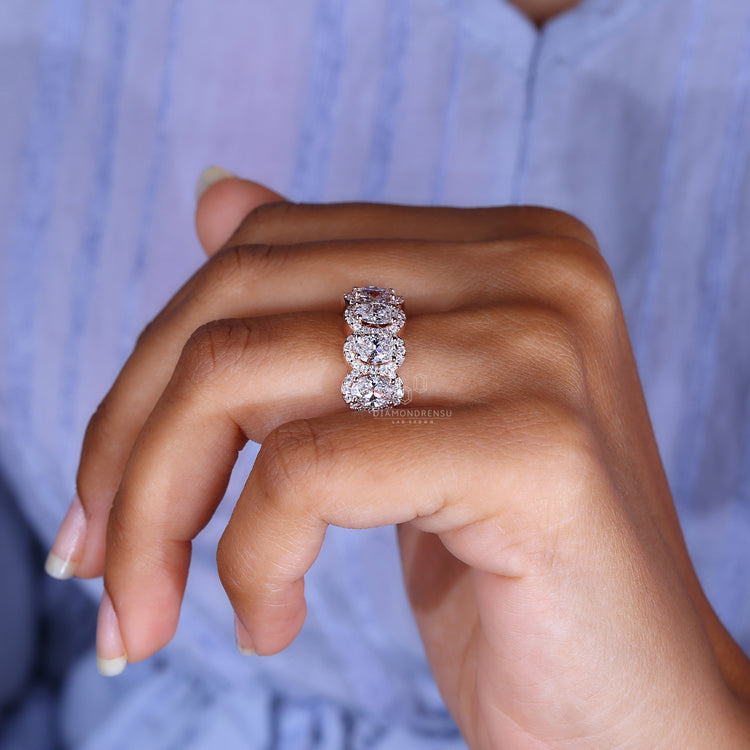 Round halo diamond engagement ring with intricate detailing and elegance.