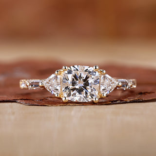 Three Stone Cushion Cut Ring with stunning trillion cut side stones.