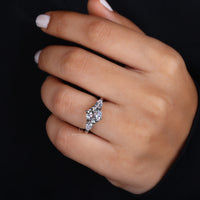 Beautiful three stone ring in modern design. Round diamond engagement ring set in classic elegance.