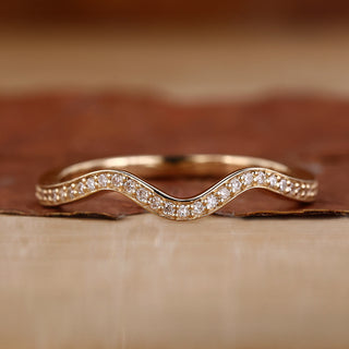 Curved wedding band in a sleek, modern design for elegance.