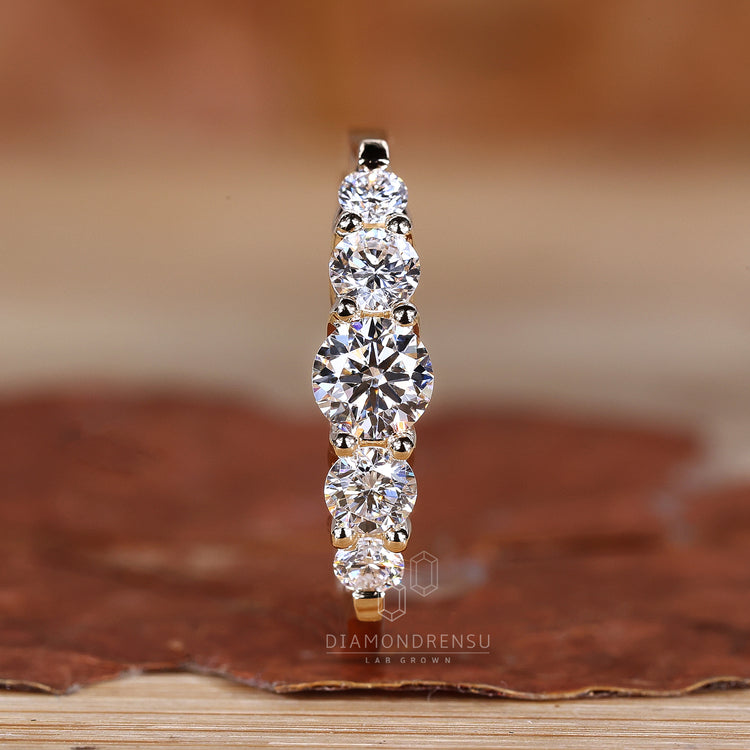 5 round diamond wedding band with prong setting.