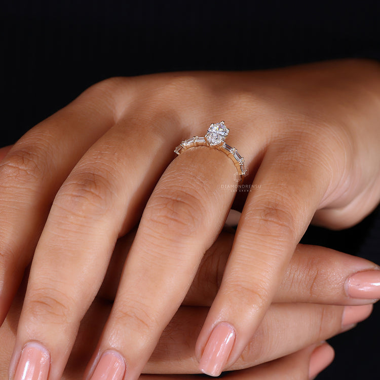 Round diamond pave band surrounding a luxurious marquise diamond.