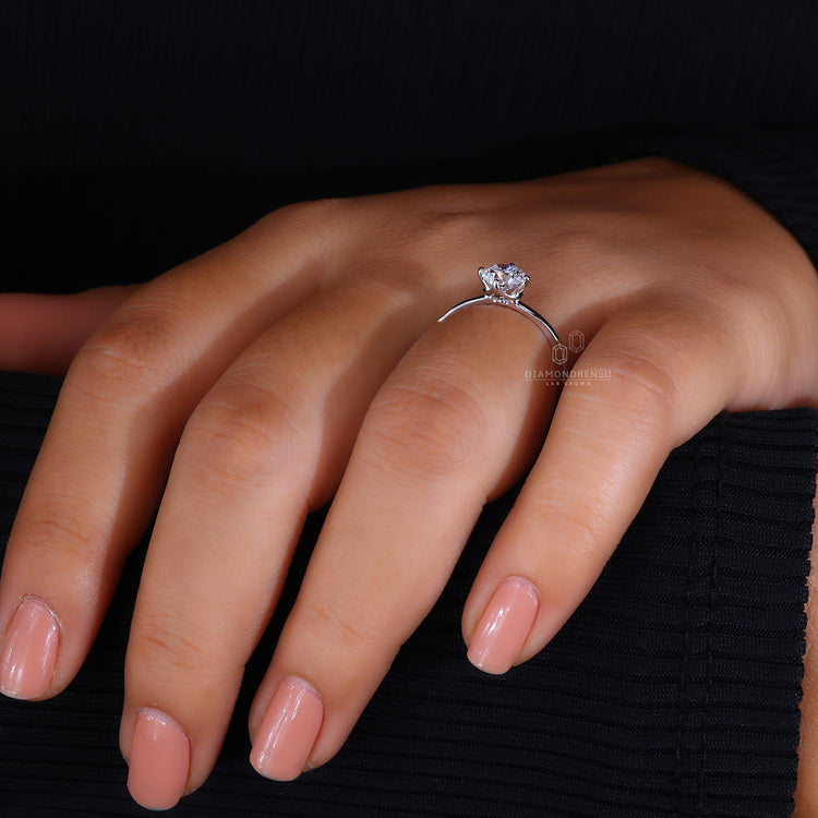 Solitaire engagement ring featuring a sparkling round diamond.