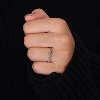 Chevron diamond wedding band featuring round-cut diamonds.