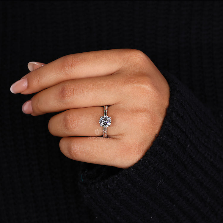 Elegant gold diamond rose ring featuring a brilliant round diamond center.