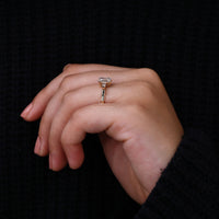 Emerald Cut Engagement Ring with tapered baguettes for elegance.