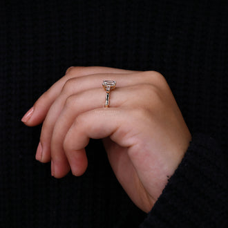 Emerald Cut Engagement Ring with tapered baguettes for elegance.