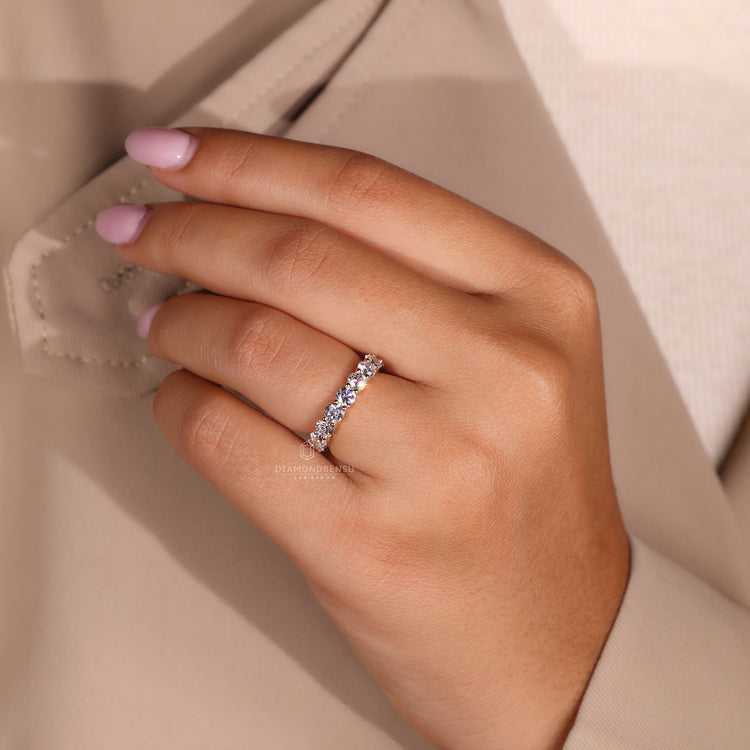 Half eternity wedding band with a delicate design.