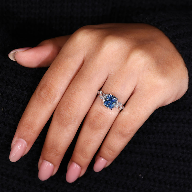 Lab grown diamond set in a white gold engagement ring with intricate detailing.