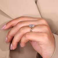 Marquise and round side stone oval diamond ring.